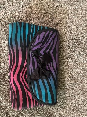 Claire's Zebra Print Bow Clutch in Pink, Purple, Teal and Black